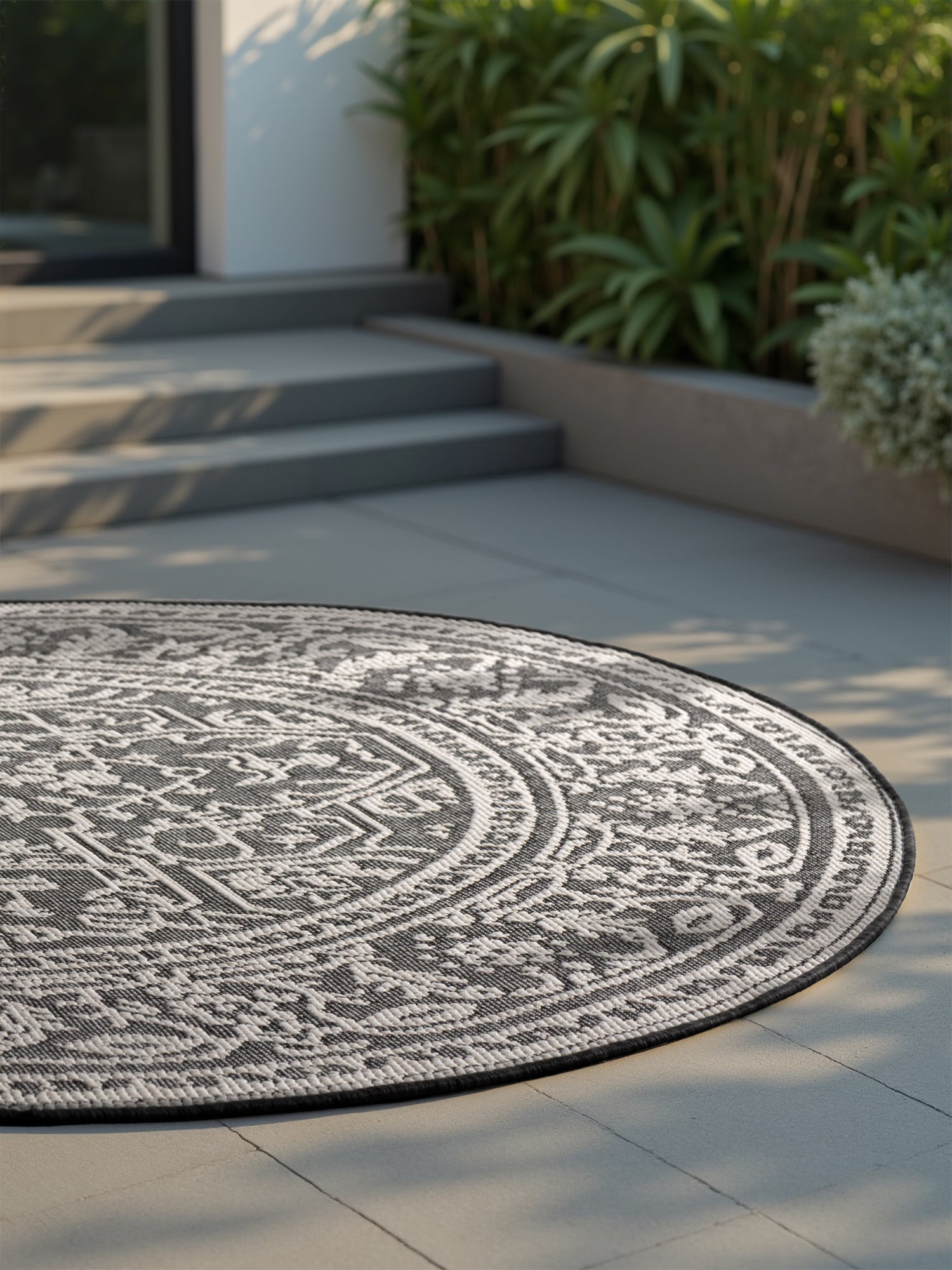 Hanse Home Duet Vändbar inom- och utomhusmatta rund Kona svart vit